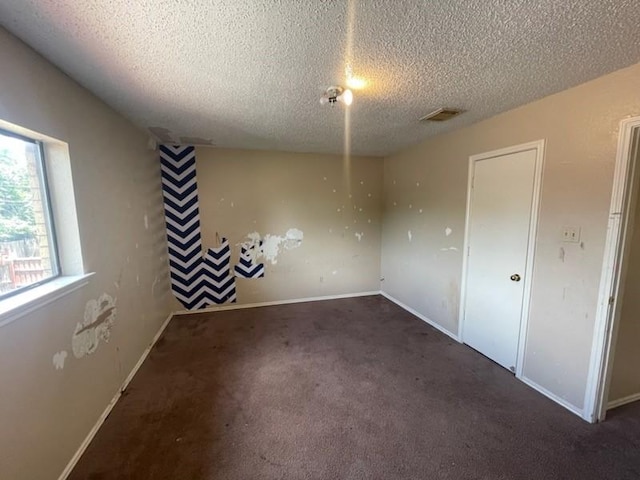 11805 Eloise Dr, Balch Springs, TX 75180 - unfurnished room with a textured ceiling and carpet floors