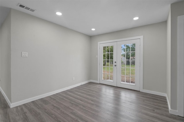 4118 Princeton Dr, Garland, TX 75042 - spare room featuring french doors, dark wood-style flooring, and recessed lighting