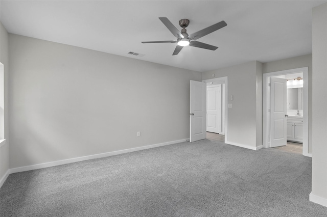 4118 Princeton Dr, Garland, TX 75042 - unfurnished bedroom featuring carpet floors, ceiling fan, and ensuite bathroom