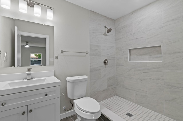 4118 Princeton Dr, Garland, TX 75042 - bathroom with a tile shower, vanity, and ceiling fan