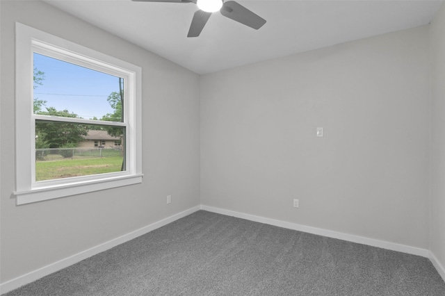 4118 Princeton Dr, Garland, TX 75042 - spare room featuring dark colored carpet and ceiling fan