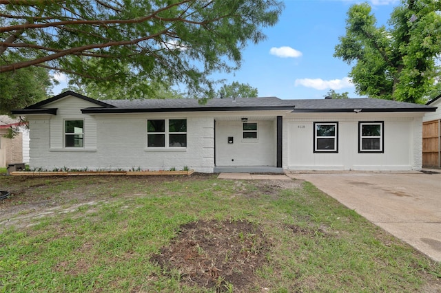 4118 Princeton Dr, Garland, TX 75042 - ranch-style house with brick siding and a front lawn