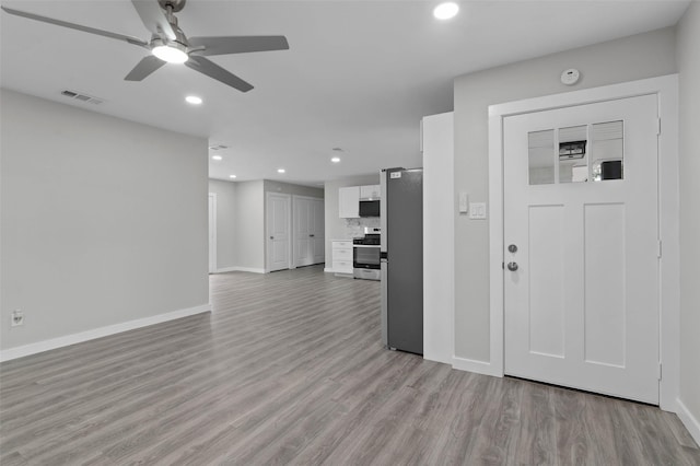 4118 Princeton Dr, Garland, TX 75042 - foyer featuring light wood-type flooring, recessed lighting, and ceiling fan