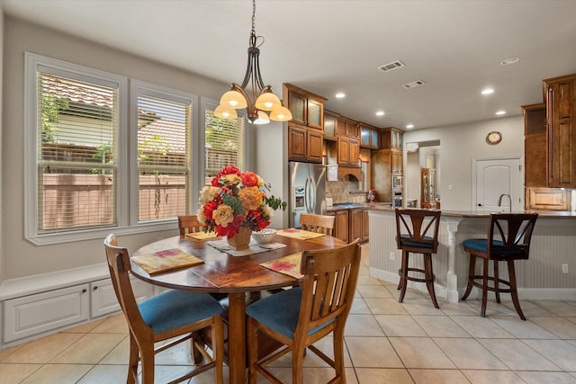 1911 Saddlehorn Ln, Mansfield, TX 76063 - dining space with light tile patterned flooring, plenty of natural light, recessed lighting, and a chandelier