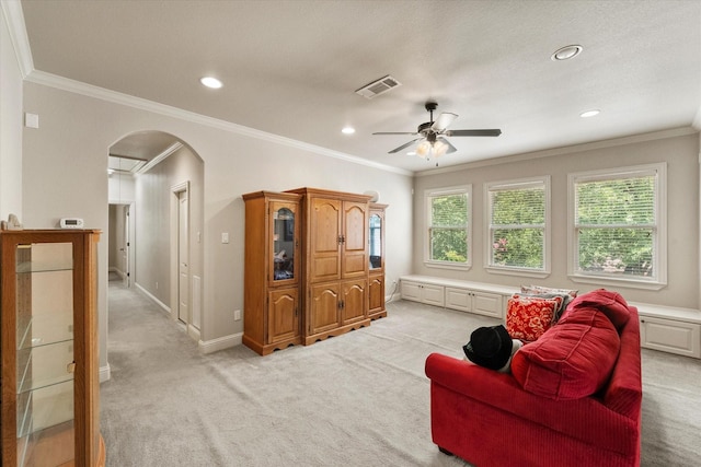 1911 Saddlehorn Ln, Mansfield, TX 76063 - living room featuring ceiling fan, arched walkways, light carpet, recessed lighting, and ornamental molding