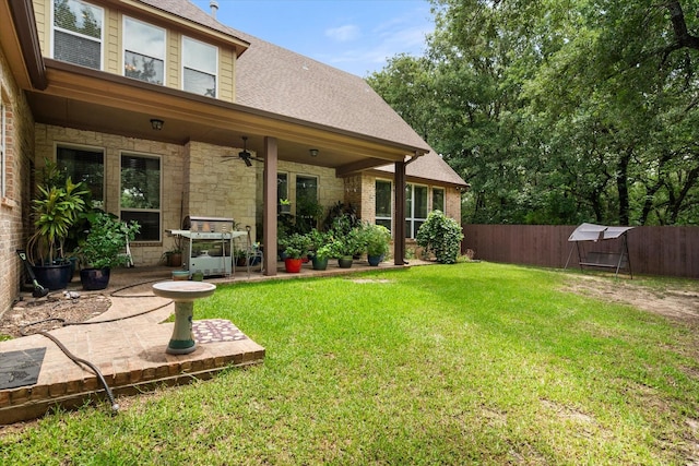 1911 Saddlehorn Ln, Mansfield, TX 76063 - fenced backyard featuring ceiling fan and a patio area