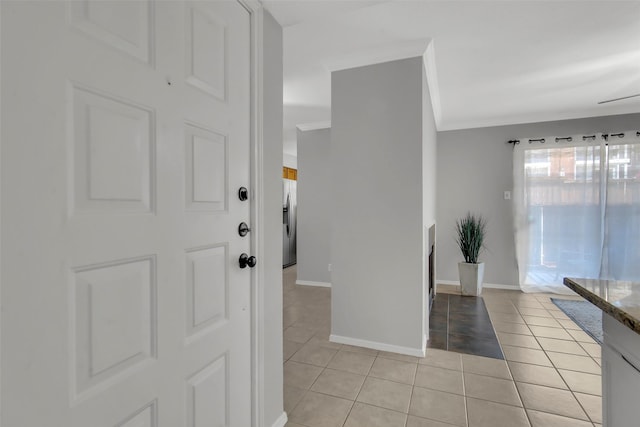 4748 Old Bent Tree Ln Unit 701, Dallas, TX 75287 - entryway featuring light tile patterned floors and ornamental molding