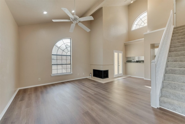 4422 Point Blvd Unit 210C, Garland, TX 75043 - unfurnished living room featuring high vaulted ceiling, wood finished floors, stairs, ceiling fan, and recessed lighting