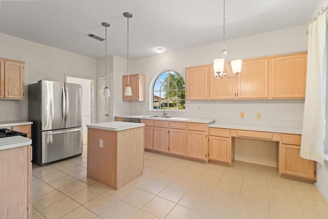 1100 Bellingham Pl, Arlington, TX 76001 - kitchen with stainless steel appliances, light brown cabinetry, and a center island