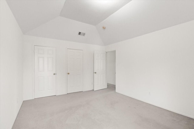1100 Bellingham Pl, Arlington, TX 76001 - unfurnished bedroom featuring light colored carpet and vaulted ceiling