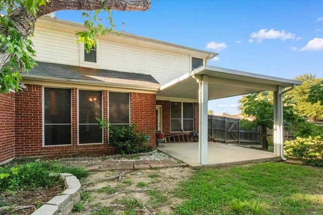 1100 Bellingham Pl, Arlington, TX 76001 - rear view of property with a patio area and brick siding