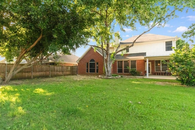 1100 Bellingham Pl, Arlington, TX 76001 - back of property with a fenced backyard, brick siding, a patio area, and a chimney