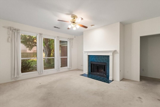 1100 Bellingham Pl, Arlington, TX 76001 - unfurnished living room with carpet floors, ceiling fan, and a tiled fireplace