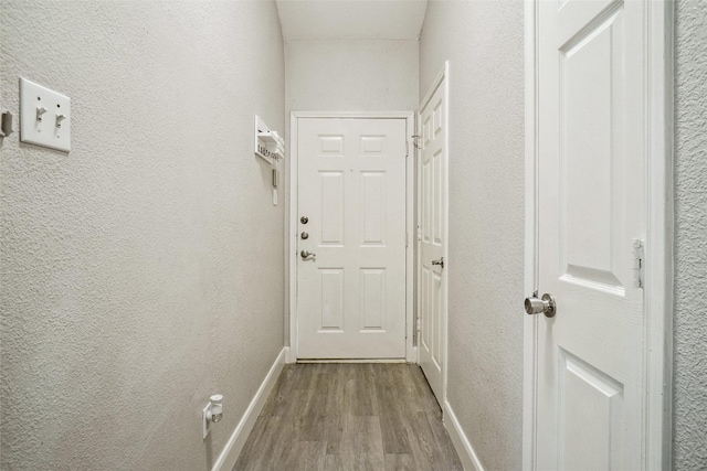 5905 Northfield Dr, Fort Worth, TX 76179 - doorway to outside featuring wood finished floors and a textured wall
