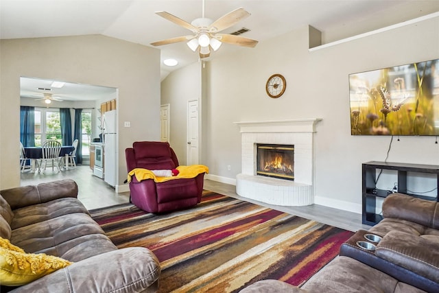 5905 Northfield Dr, Fort Worth, TX 76179 - living area featuring a ceiling fan, lofted ceiling, a fireplace, and wood finished floors