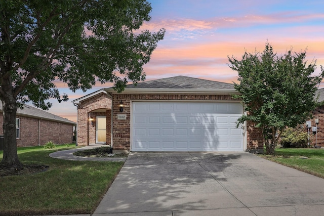 7850 Estancia Dr, Frisco, TX 75036 - view of front of property featuring driveway, brick siding, a garage, and a lawn