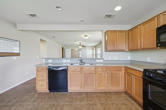 7850 Estancia Dr, Frisco, TX 75036 - kitchen with black appliances, light countertops, a peninsula, ceiling fan, and recessed lighting