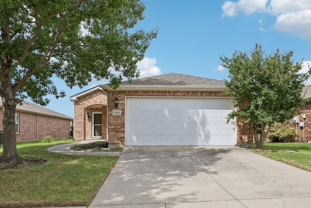 7850 Estancia Dr, Frisco, TX 75036 - view of front of home featuring driveway, brick siding, a garage, and a front yard