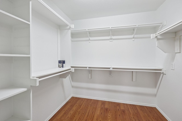 7850 Estancia Dr, Frisco, TX 75036 - spacious closet with wood finished floors