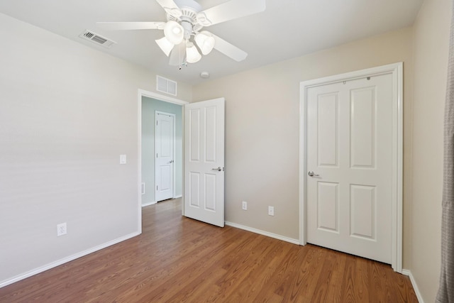 7850 Estancia Dr, Frisco, TX 75036 - unfurnished bedroom with wood finished floors and ceiling fan
