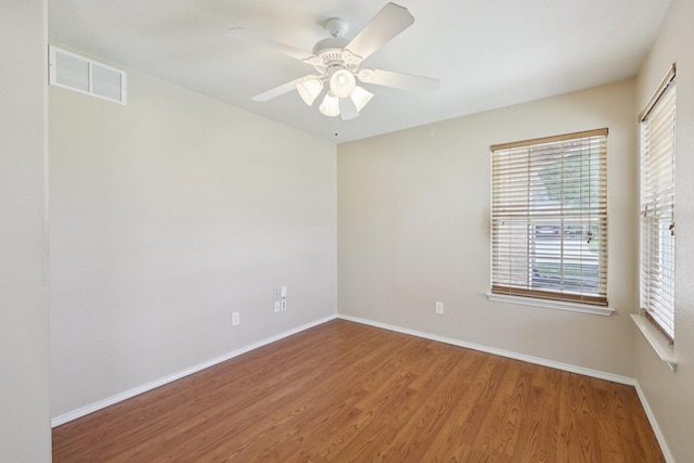 7850 Estancia Dr, Frisco, TX 75036 - spare room with wood finished floors, plenty of natural light, and ceiling fan