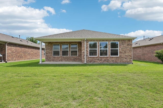7850 Estancia Dr, Frisco, TX 75036 - back of house with a patio, a yard, and brick siding