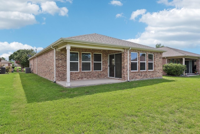 7850 Estancia Dr, Frisco, TX 75036 - rear view of property featuring a patio, a yard, and brick siding