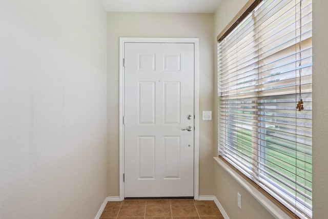 7850 Estancia Dr, Frisco, TX 75036 - doorway to outside with healthy amount of natural light and tile patterned flooring