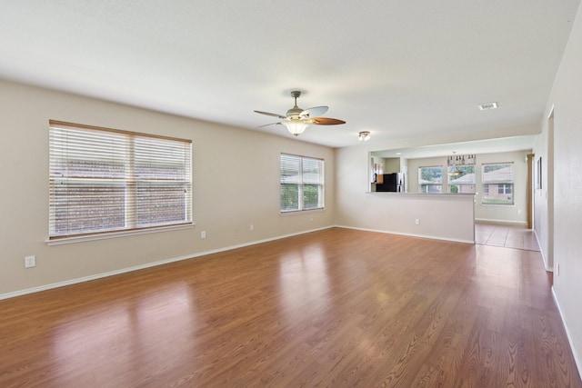 7850 Estancia Dr, Frisco, TX 75036 - empty room with ceiling fan and wood finished floors