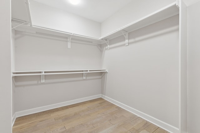 2300 Leonard St Unit 305, Dallas, TX 75201 - walk in closet with light wood finished floors