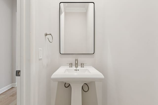2300 Leonard St Unit 305, Dallas, TX 75201 - bathroom featuring wood finished floors and ornamental molding
