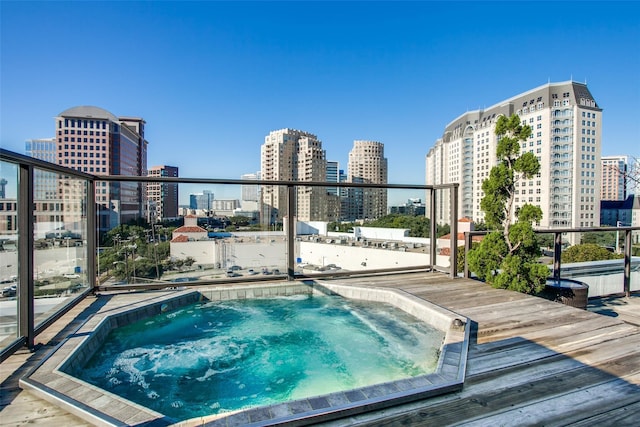 2300 Leonard St Unit 305, Dallas, TX 75201 - view of swimming pool featuring a skyline view and a wooden deck