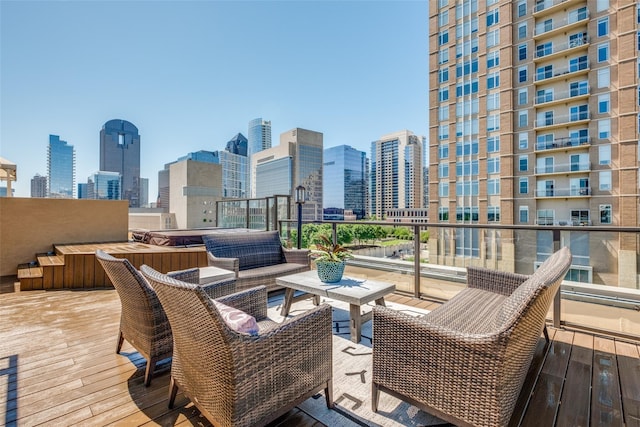 2300 Leonard St Unit 305, Dallas, TX 75201 - wooden terrace featuring a skyline view and an outdoor hangout area