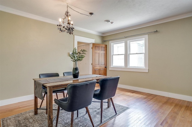2012 Carleton Ave, Fort Worth, TX 76107 - dining space with a chandelier, crown molding, and light wood-style floors
