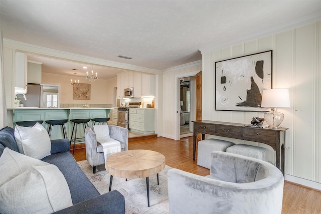 2012 Carleton Ave, Fort Worth, TX 76107 - living area with a chandelier, crown molding, and light wood-type flooring