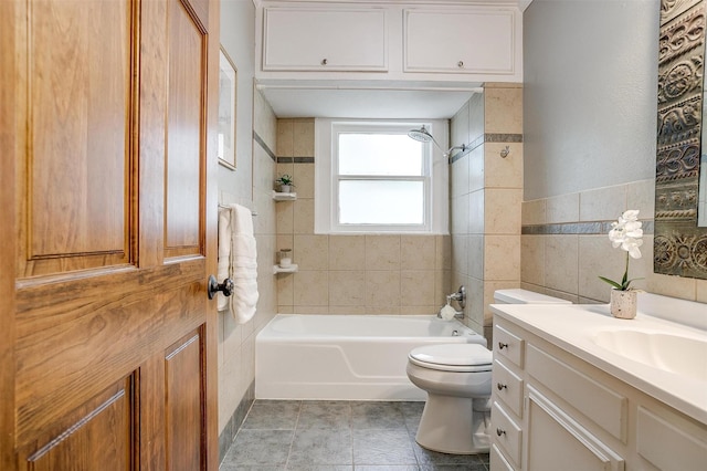 2012 Carleton Ave, Fort Worth, TX 76107 - full bathroom featuring tile walls, shower / bathtub combination, vanity, and tile patterned floors