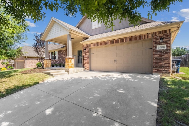 6308 Harold Creek Dr, Fort Worth, TX 76179 - view of front of home with brick siding, driveway, a front lawn, and a garage