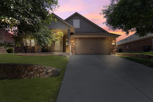 6308 Harold Creek Dr, Fort Worth, TX 76179 - view of front facade featuring a garage, concrete driveway, a lawn, and brick siding