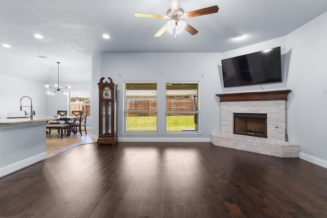 6308 Harold Creek Dr, Fort Worth, TX 76179 - living area featuring a fireplace, recessed lighting, ceiling fan, a chandelier, and wood finished floors