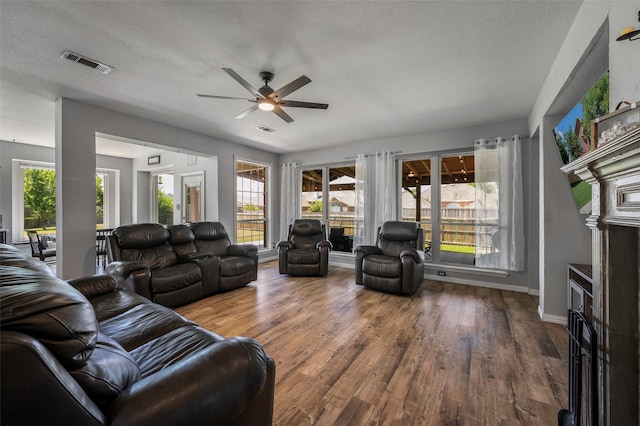 7305 Meadowwood Dr, Rowlett, TX 75089 - living room with ceiling fan, a textured ceiling, and wood finished floors