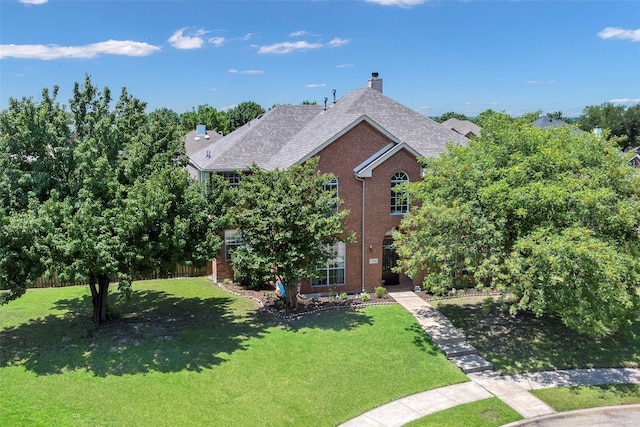 7305 Meadowwood Dr, Rowlett, TX 75089 - view of front of property with brick siding, a front yard, a chimney, and roof with shingles