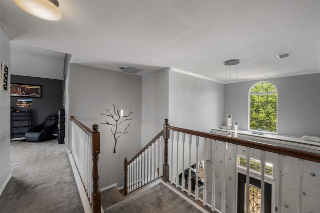 7305 Meadowwood Dr, Rowlett, TX 75089 - hallway featuring an upstairs landing, carpet, and crown molding