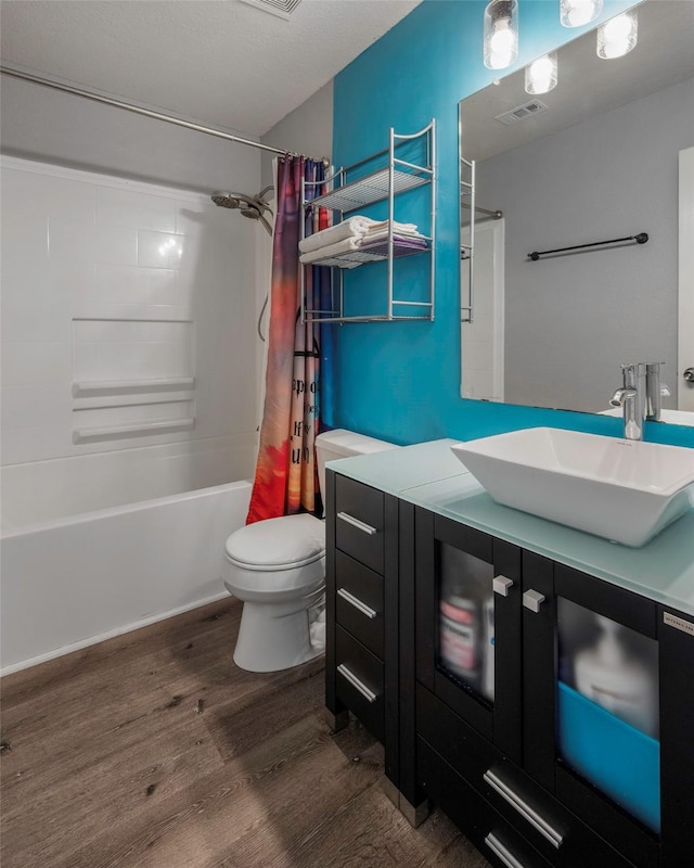 7305 Meadowwood Dr, Rowlett, TX 75089 - bathroom with wood finished floors, shower / tub combo with curtain, and vanity