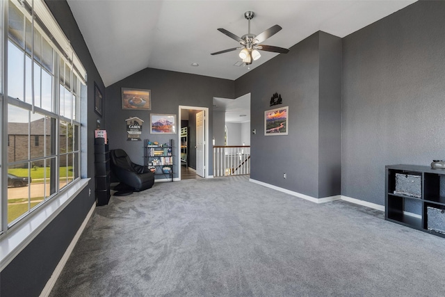 7305 Meadowwood Dr, Rowlett, TX 75089 - living area featuring carpet flooring, vaulted ceiling, ceiling fan, and an upstairs landing