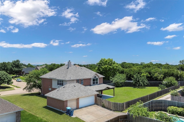 7305 Meadowwood Dr, Rowlett, TX 75089 - back of property featuring concrete driveway, a fenced backyard, roof with shingles, and a chimney