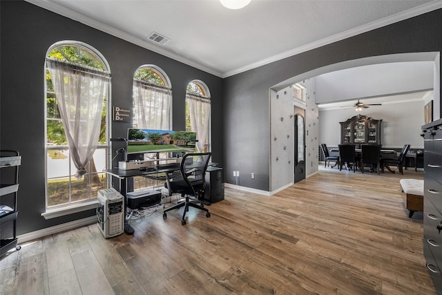 7305 Meadowwood Dr, Rowlett, TX 75089 - office space featuring wood finished floors, arched walkways, crown molding, and a ceiling fan