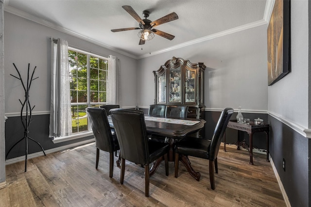 7305 Meadowwood Dr, Rowlett, TX 75089 - dining room featuring a ceiling fan, ornamental molding, and wood finished floors
