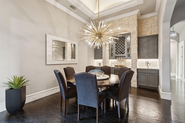 1800 Aspen St, Prosper, TX 75078 - dining room with arched walkways, ornamental molding, dark wood-style floors, and a chandelier