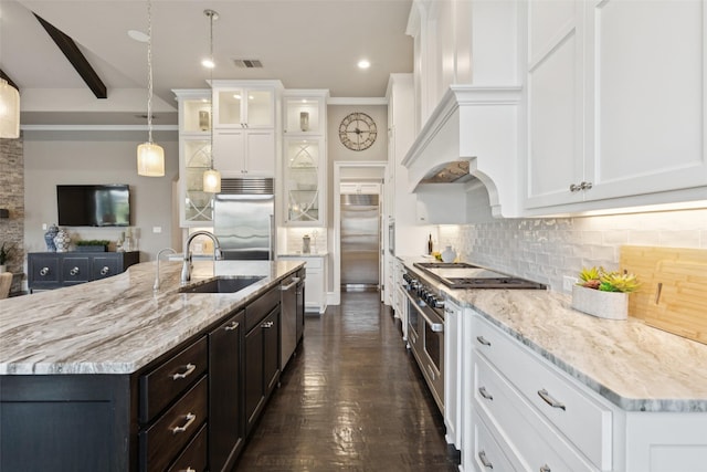 1800 Aspen St, Prosper, TX 75078 - kitchen with high end appliances, white cabinetry, backsplash, glass insert cabinets, and light stone countertops
