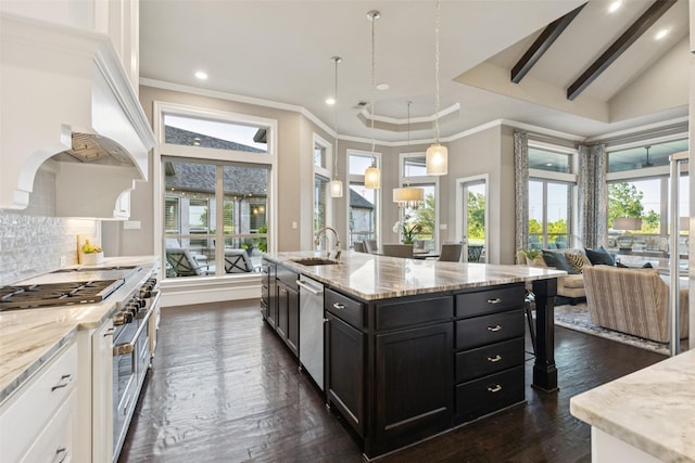1800 Aspen St, Prosper, TX 75078 - kitchen featuring stainless steel appliances, healthy amount of natural light, open floor plan, ornamental molding, and backsplash